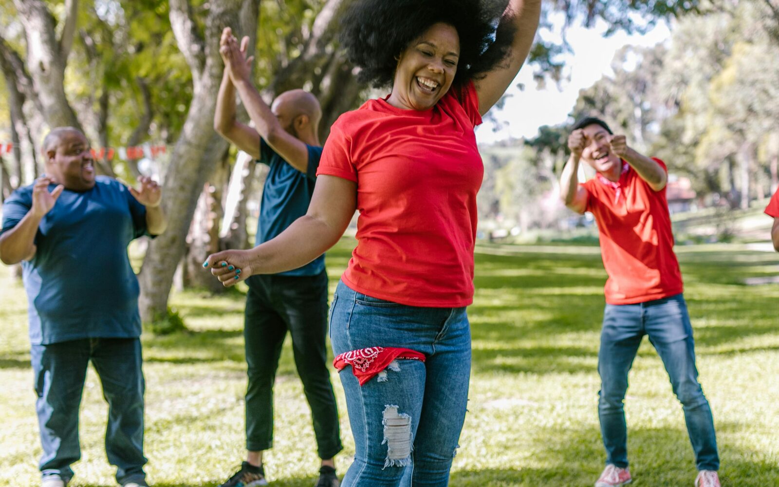 Woman celebrating with community in the park